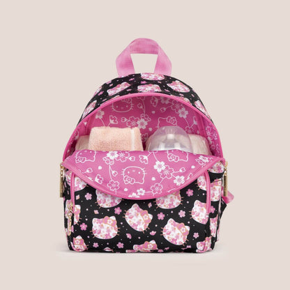 Hello Kitty® × JuJuBe Cherry Blossoms Everyday Mini Diaper Bag Backpack and baby items inside