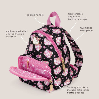 Hello Kitty® × JuJuBe Cherry Blossoms Everyday Mini Diaper Bag Backpack, shown with an open front zip pocket and multiple text callouts highlighting features