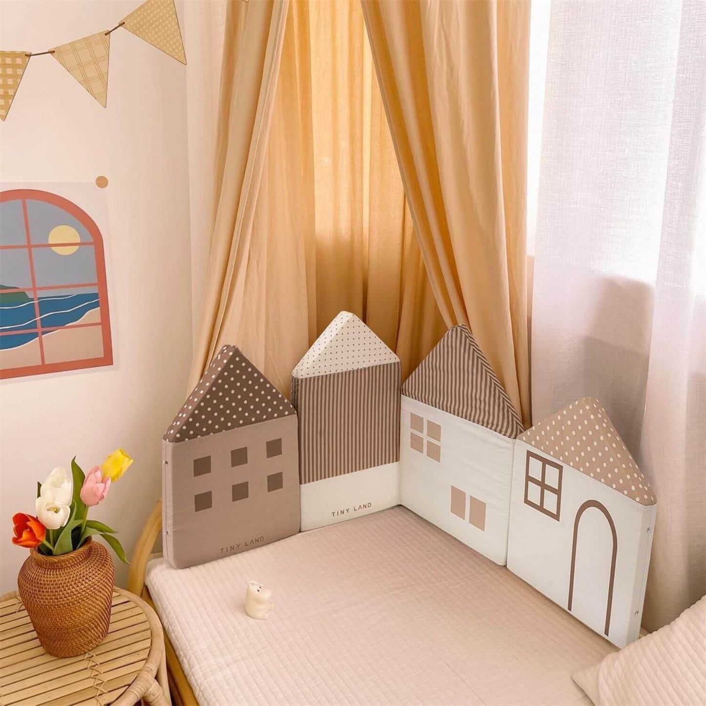 Children's room with Tiny Land® Children's Back Cushions and a small table with flowers.