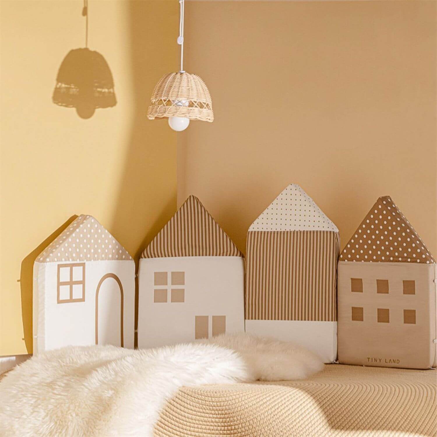 Tiny Land® Children's Back Cushions on a beige surface with hanging pendant lights.