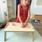 Kid Playing at RAD Children's Furniture Chowki Table