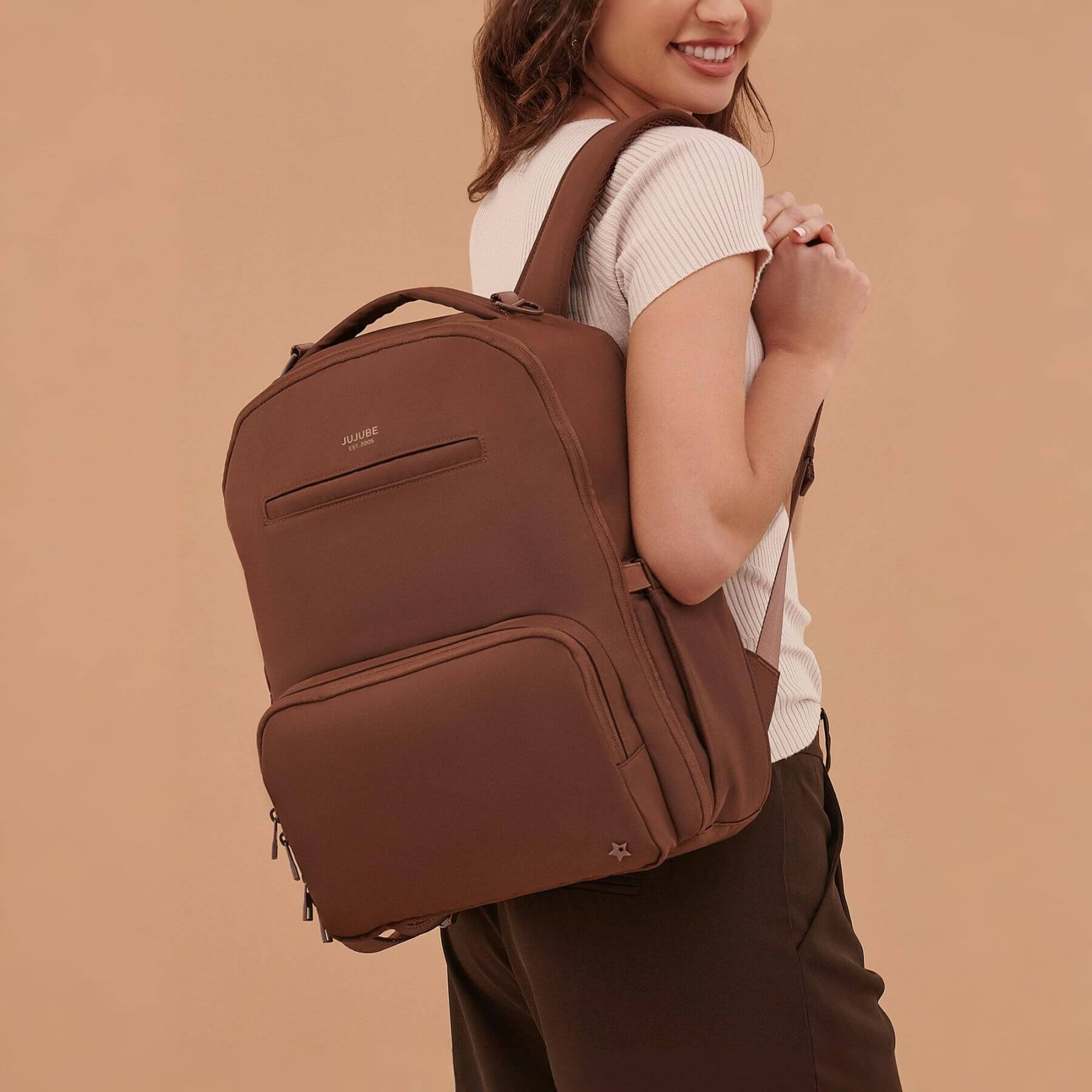 Woman wearing JuJuBe Classic Diaper Backpack Espresso