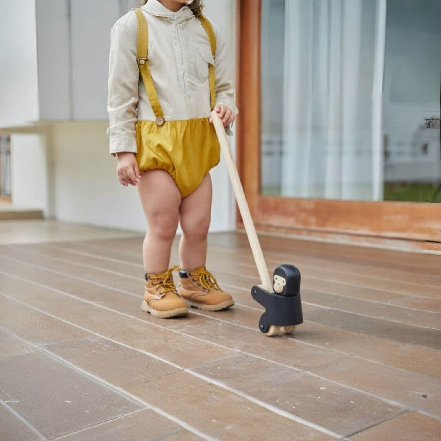 Girl Playing PlanToys Climbing Gorilla