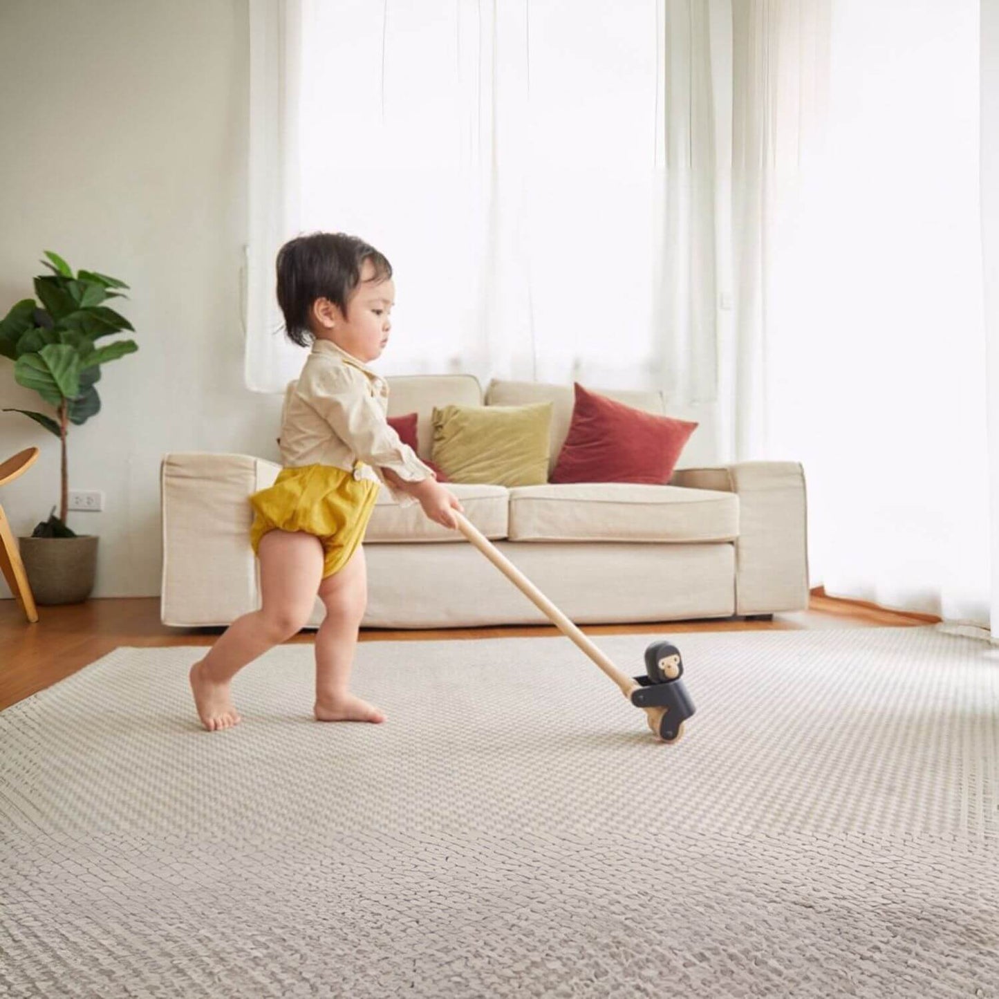 Baby Playing PlanToys Climbing Gorilla