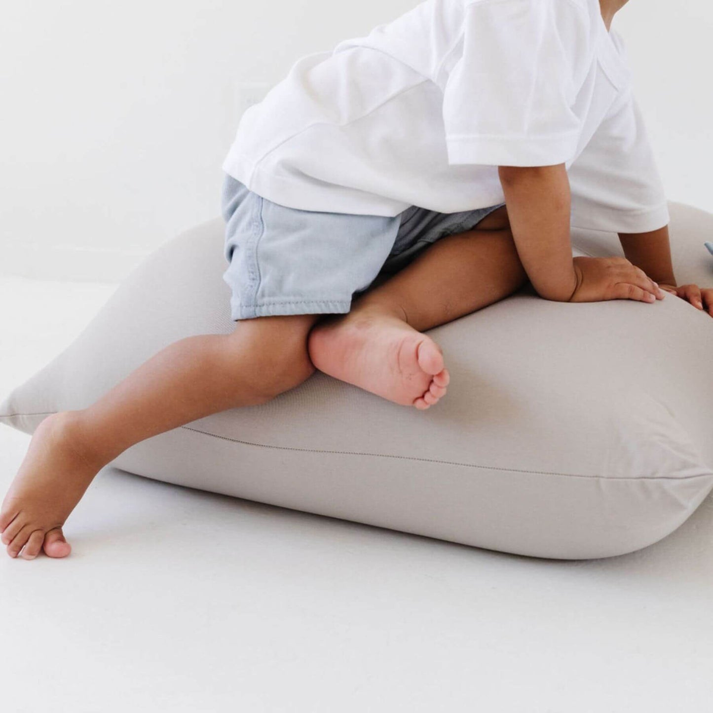 A child sits on Toki Kids Cloud Bean Bag