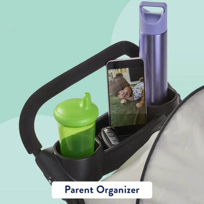 Stroller organizer with a sippy cup, phone, and water bottle on a light blue background