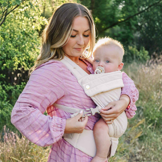 Woman holding a baby in Coco Cream - Cotton Linen Baby Carrier