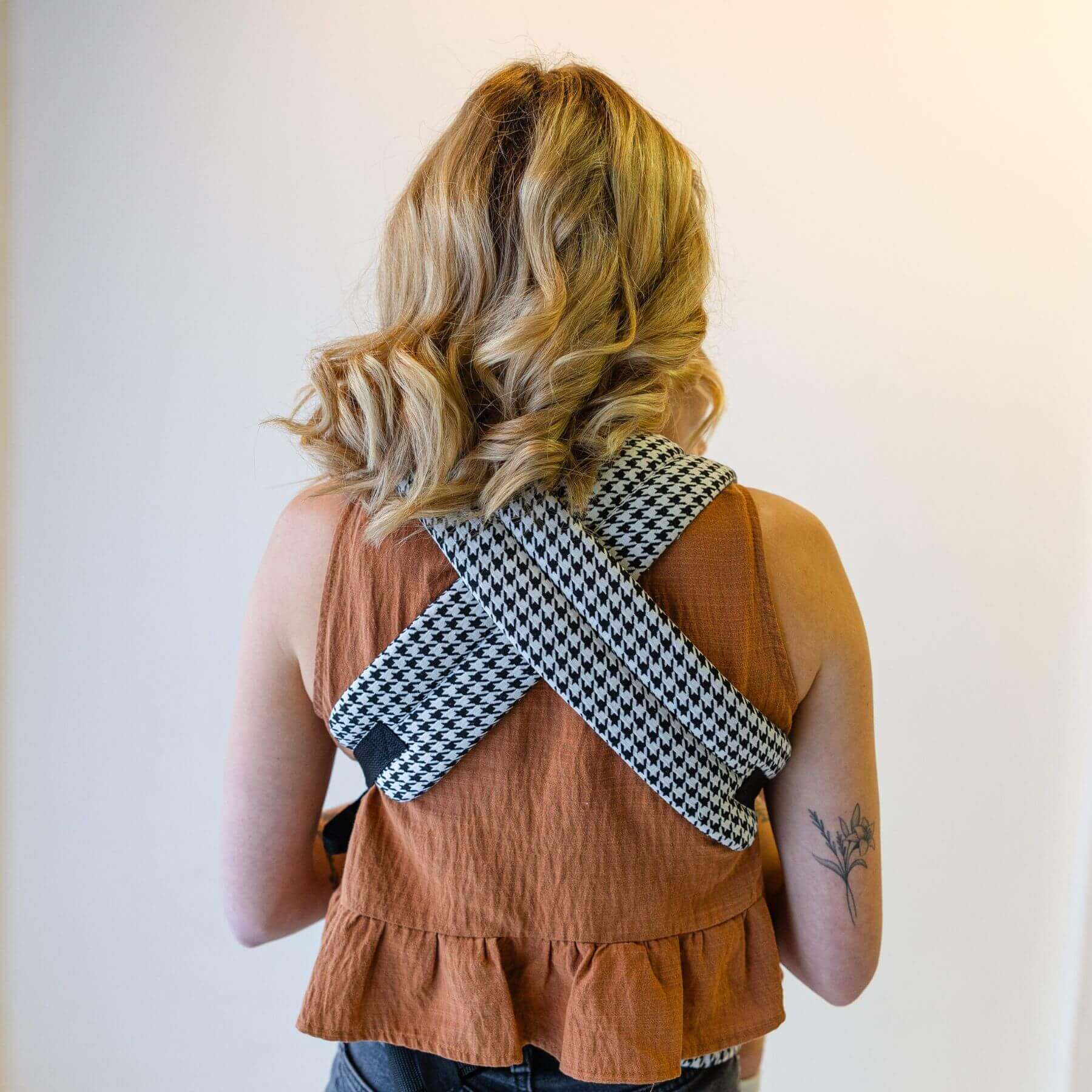 Person wearing Coco Houndstooth - Woven Jacquard over their shoulder