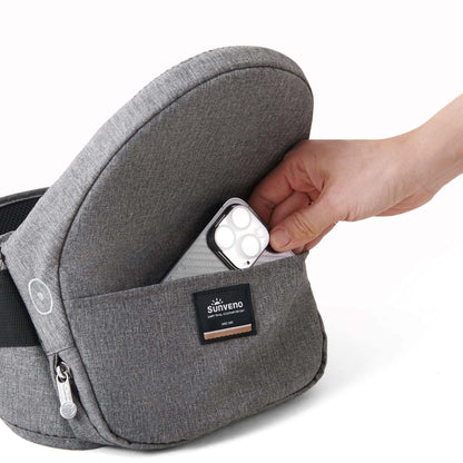 Hand putting a phone into Sunveno Collapsible Hipseat Carrier