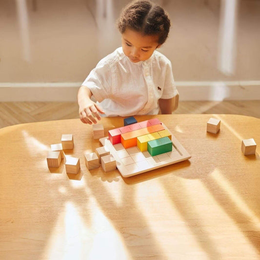 Girl Playing PlanToys Colored Counting Blocks - Unit Plus