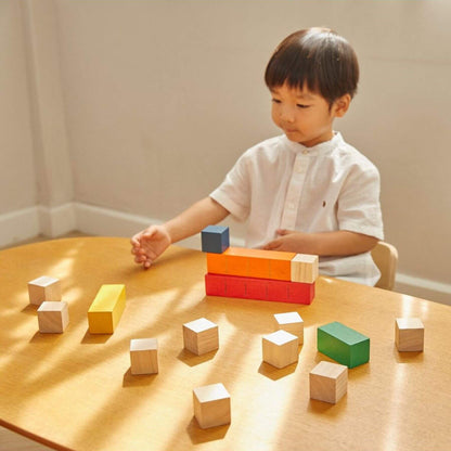 Boy Playing PlanToys Colored Counting Blocks - Unit Plus