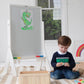 Boy Sitting next to Little Partners Contempo Art Easel White