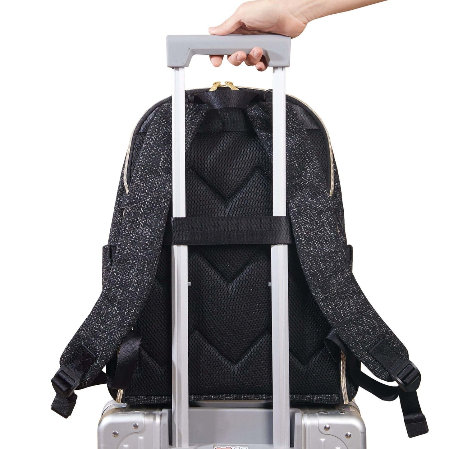 Sunveno Convertible Tweed Diaper Backpack Black attached to a suitcase