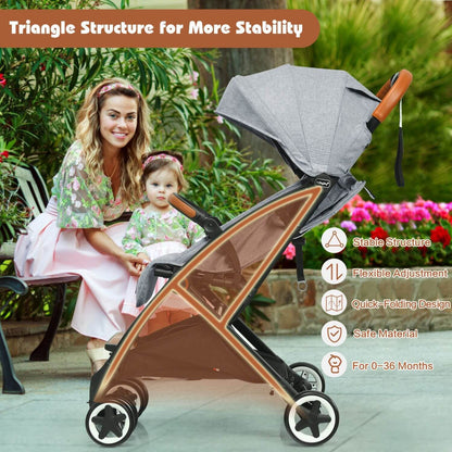Woman pushing a stroller with a child in a garden setting, highlighting stroller features.