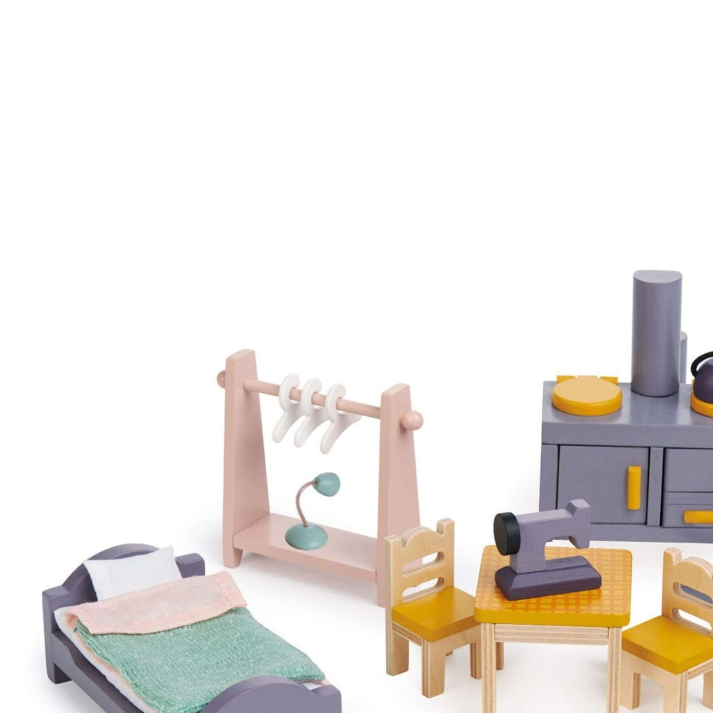 Set of toy furniture including a bed, table, chairs, and shelves on a white background