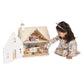Child playing with Tender Leaf Cottontail Cottage on a white background