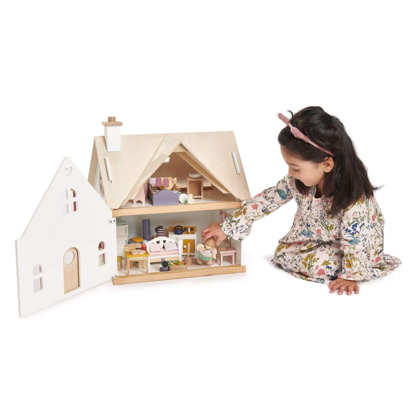 Child playing with Tender Leaf Cottontail Cottage on a white background