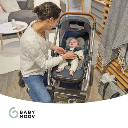 Woman adjusting a baby in a stroller with 'Baby Moov' branding.