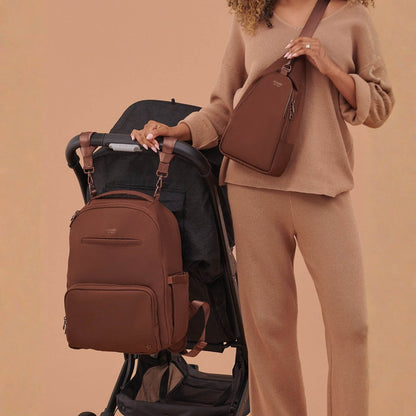 Woman carrying JuJuBe Crossbody Sling - Espresso