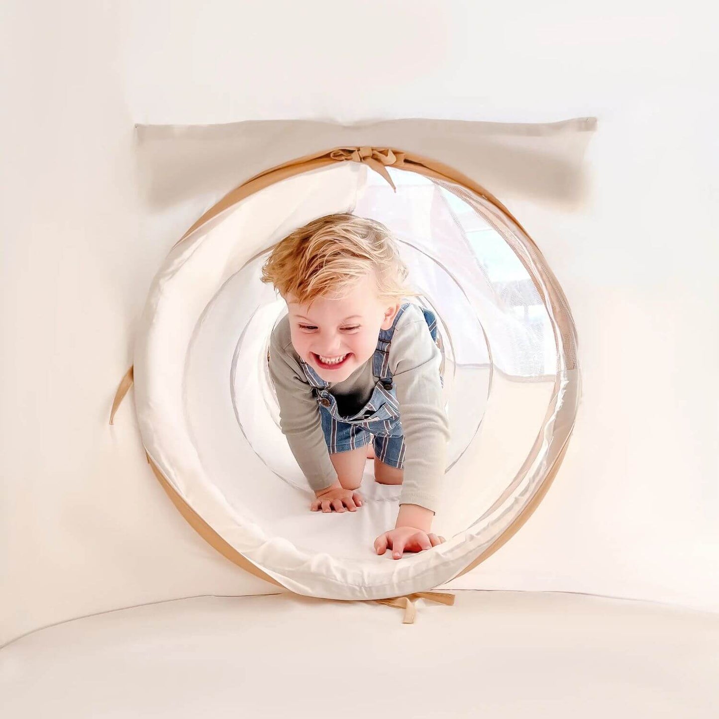 Boy Crawling in Tiny Land® Discovery 5-in-1 Play Tunnel