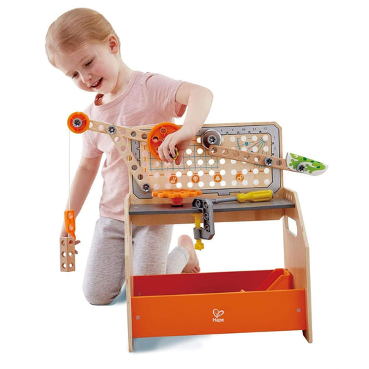 Child playing with Hape Discovery Scientific Workbench
