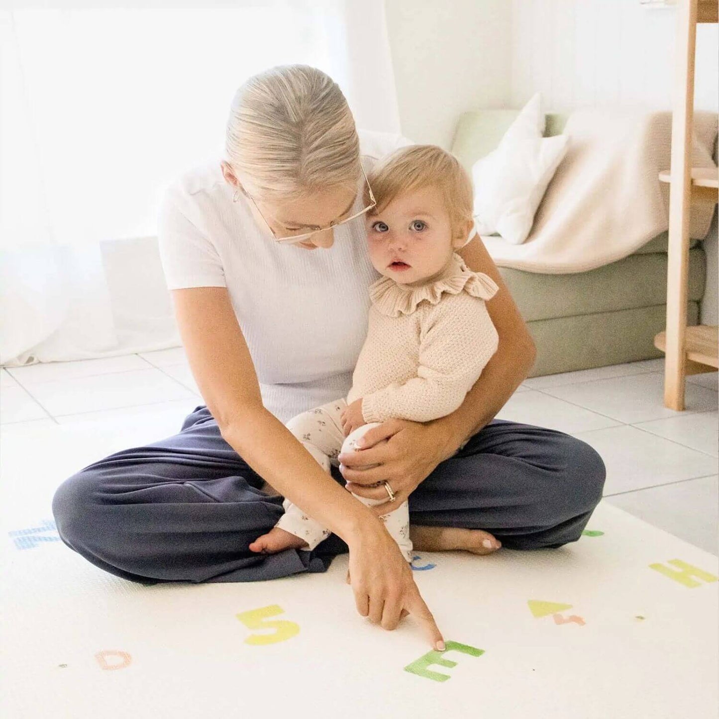 Mom and Baby Sitting on Double-Sided Baby Playmat Alphabet Adventure