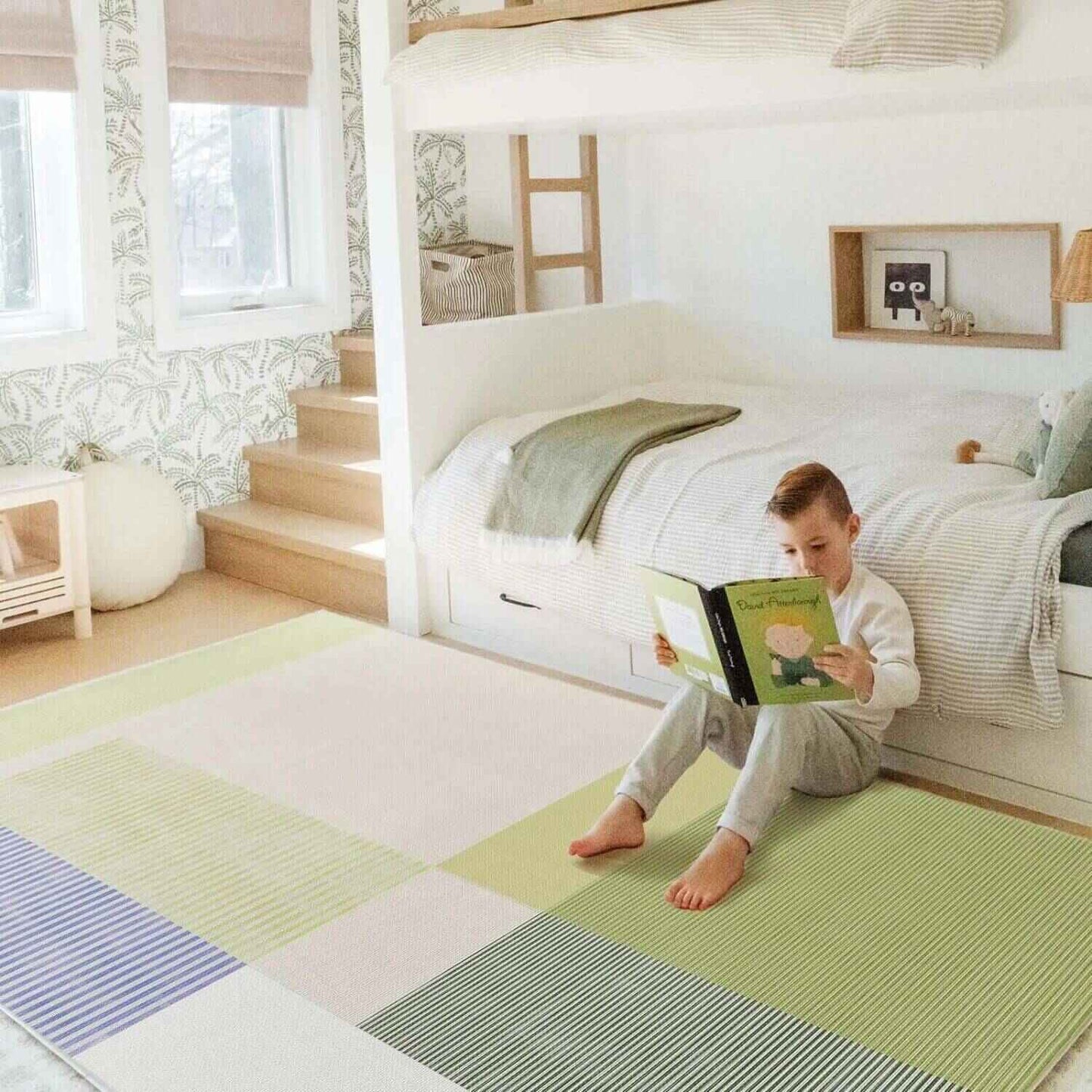 Boy Reading, Sitting on Double-Sided Baby Playmat Alphabet Adventure