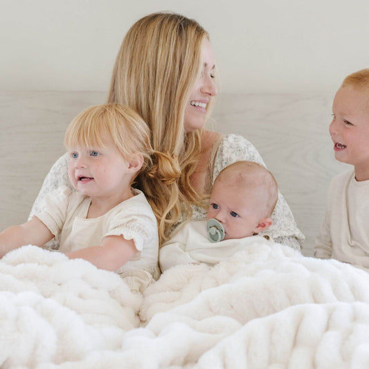 Mom & Kids under Saranoni Double Ruched Faux Fur Throw Blankets Snow