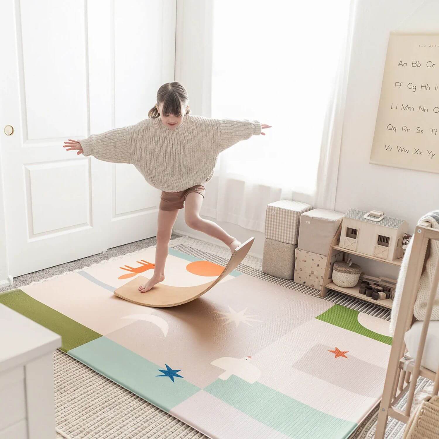 Girl Playing Balance Board on Tiny Land® Double-Sided Baby Playmat Forest Track Wonder