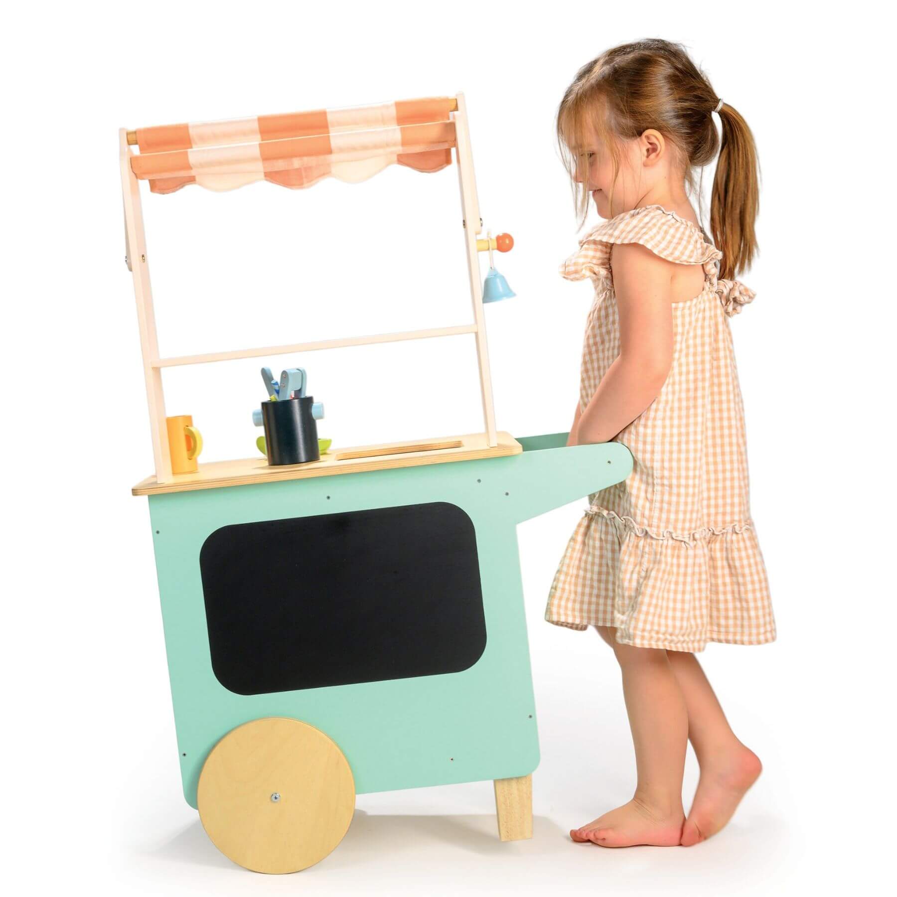 Child playing with Tender Leaf Drinks Trolley on a white background