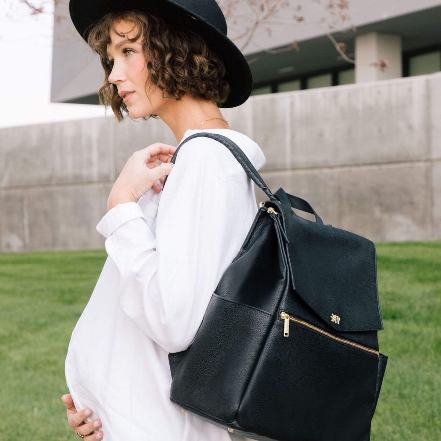 Woman wearing Ebony Classic Diaper Bag II outdoors