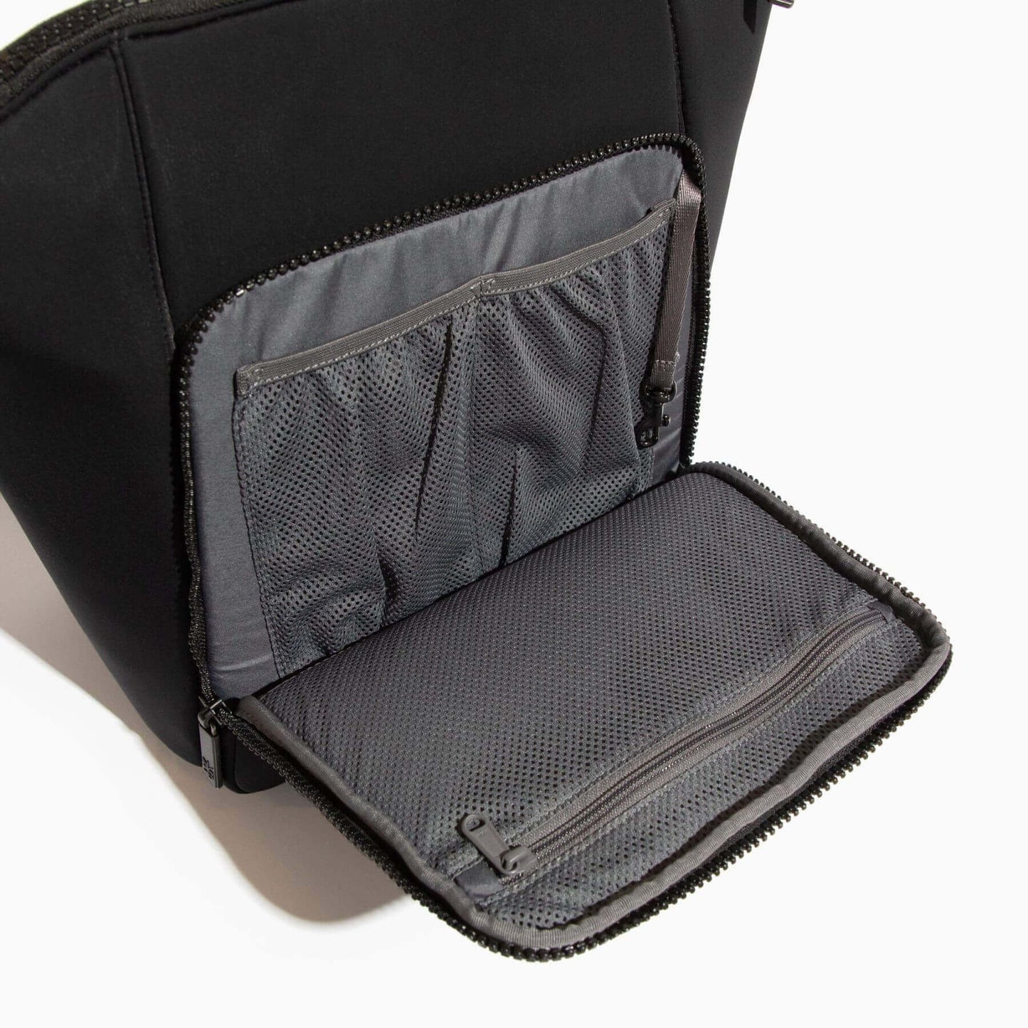 Ebony Seoul Neoprene Backpack II with open gray compartment