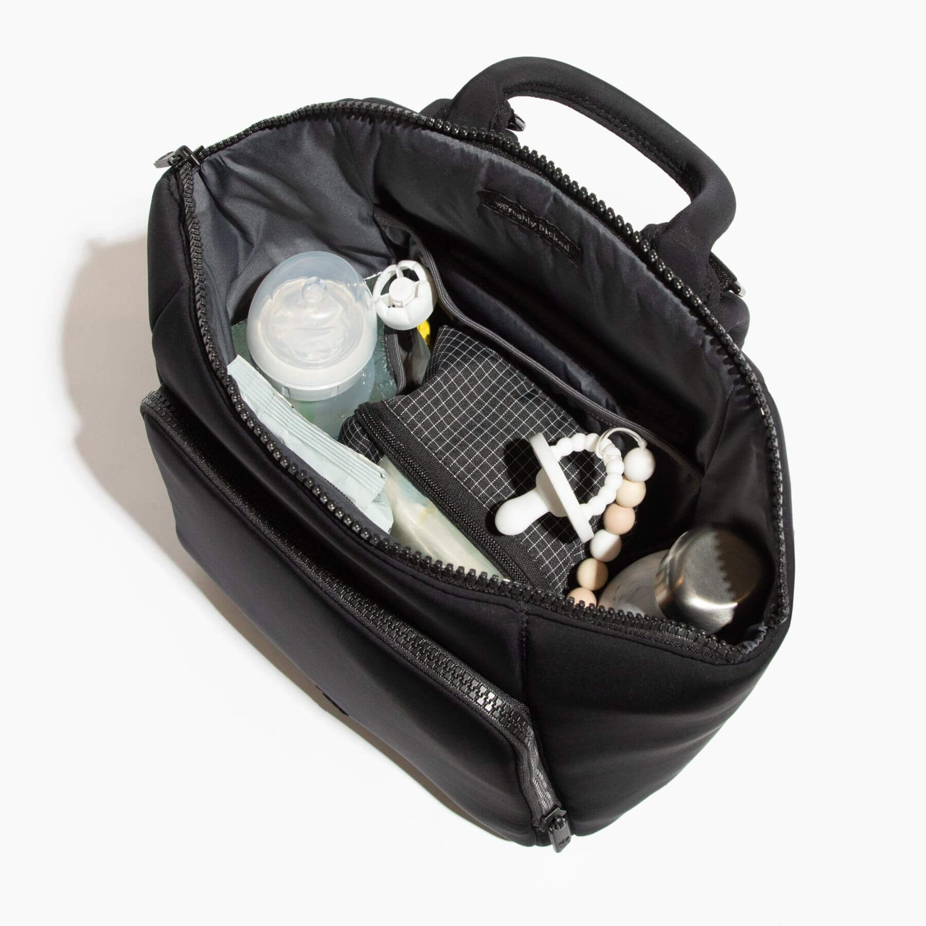 Ebony Seoul Neoprene Backpack II with toiletries and accessories