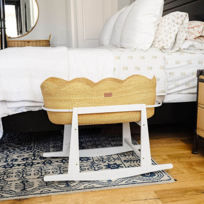 Elaine Bassinet with white stand in a bedroom setting