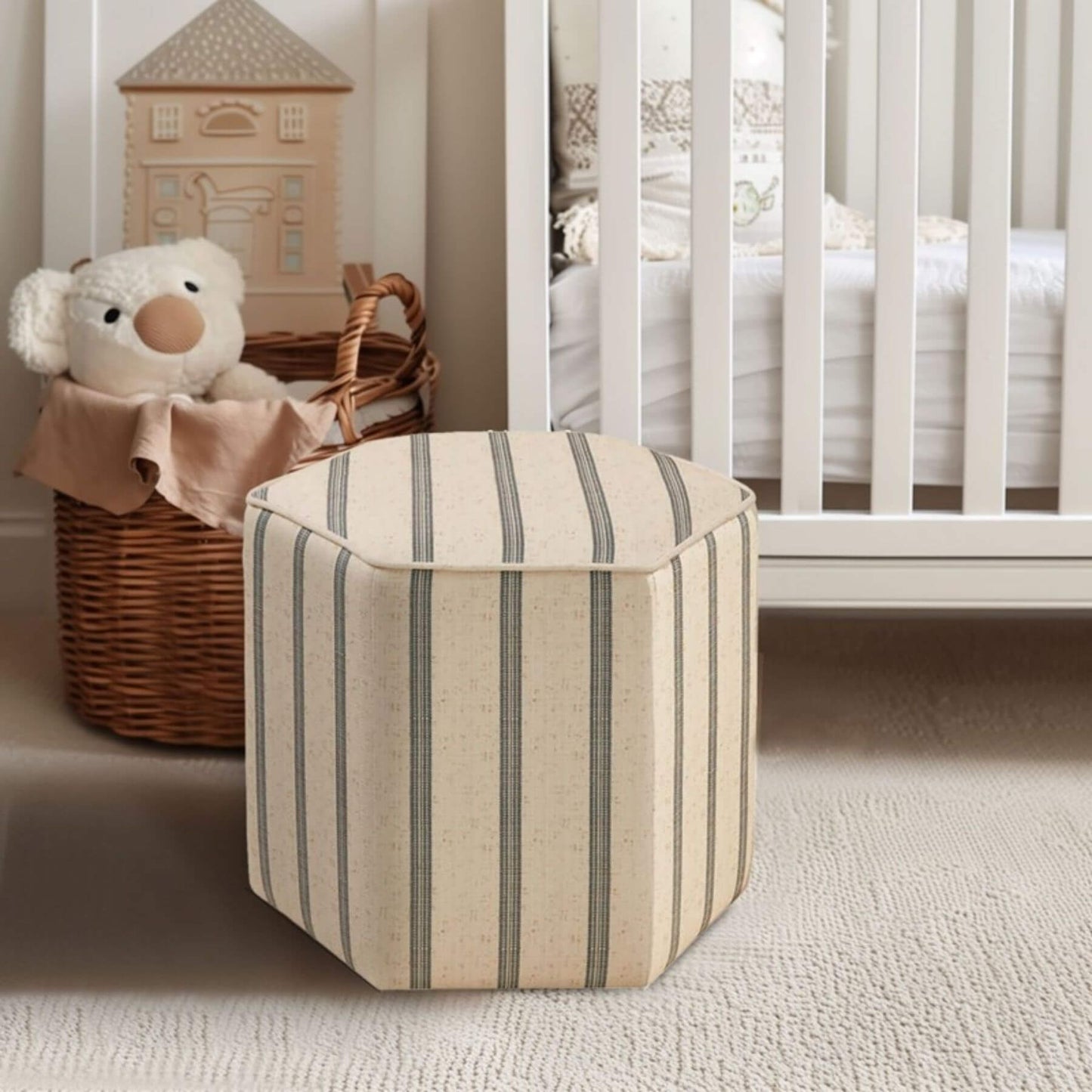 Martha Stewart Ellen Accent Ottoman in a nursery with a teddy bear and basket.