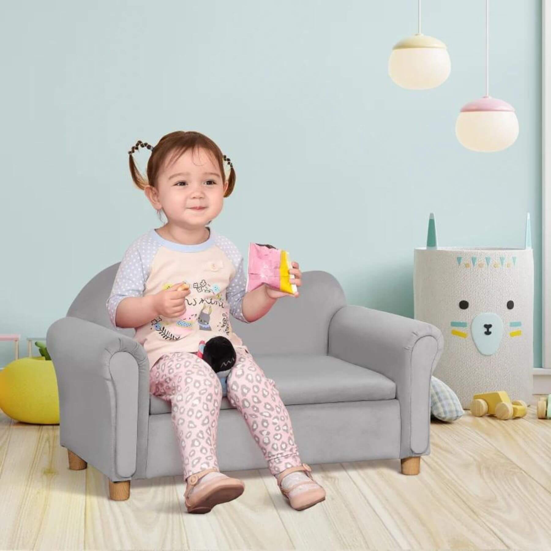 Girl Sitting on Qaba Ergonomic Foam Kids Sofa with Inner Toy Storage Chest Gray