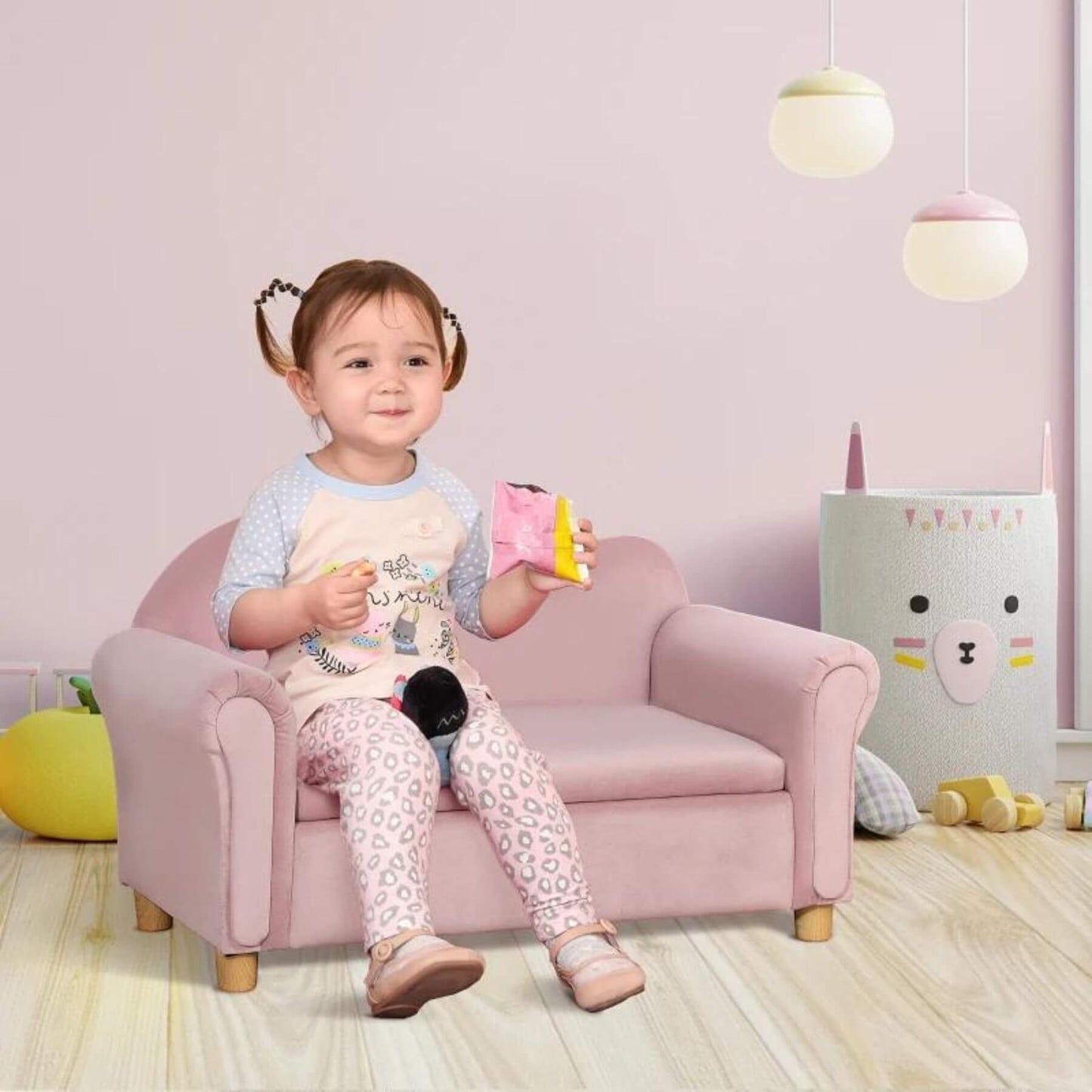 Girl Sitting on Qaba Ergonomic Foam Kids Sofa with Inner Toy Storage Chest Pink