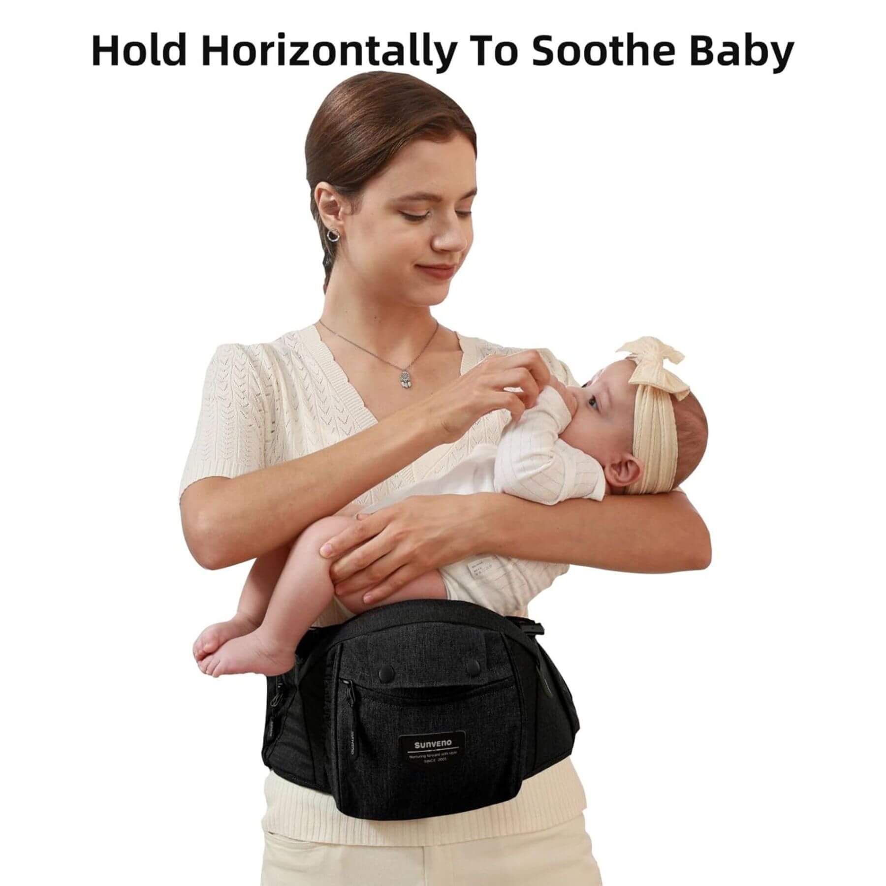 Woman carrying a baby with Sunveno Ergonomic Baby Carrier 3-in-1 Black