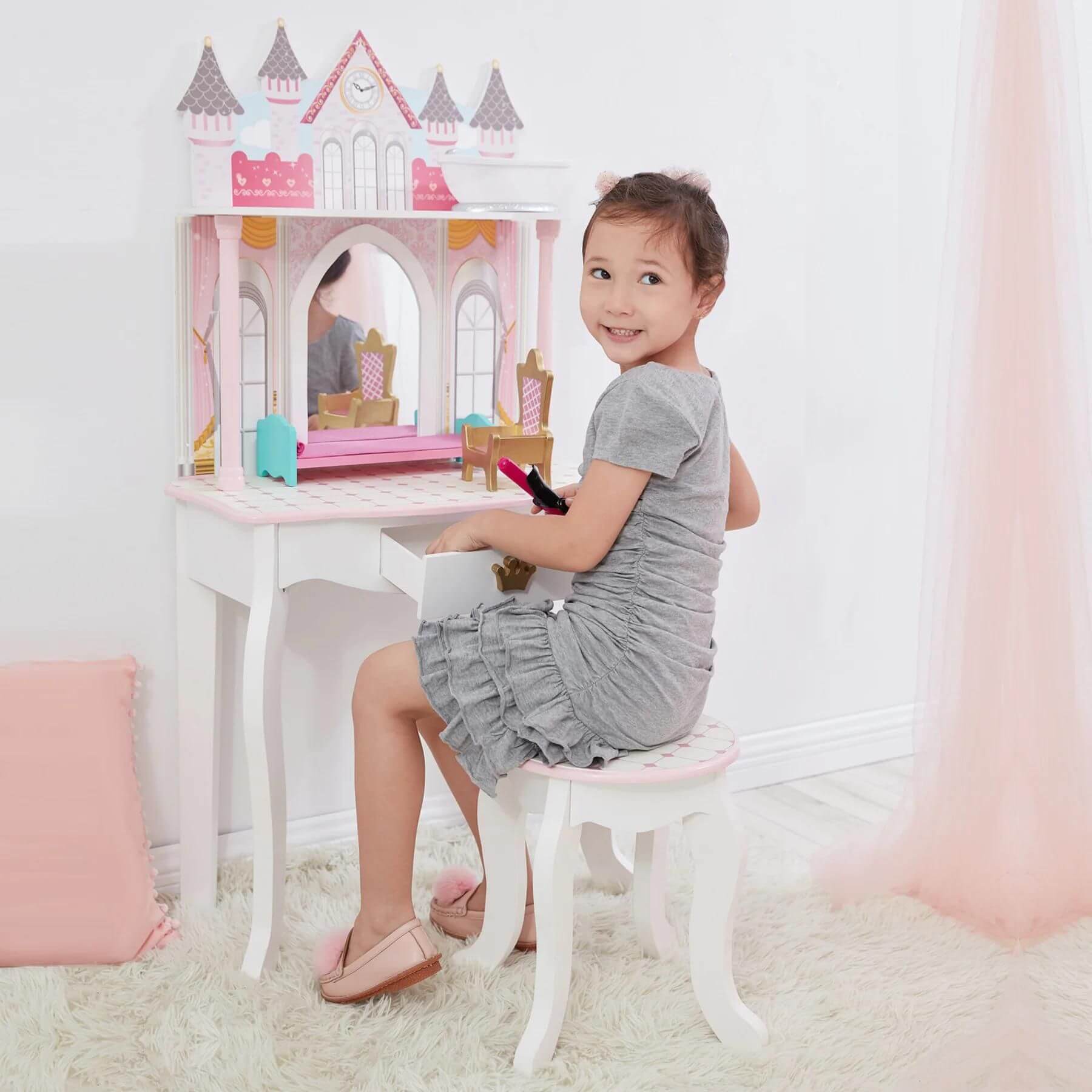 Girl Sitting at Fantasy Fields Kids Dreamland Castle Vanity Set White/Pink