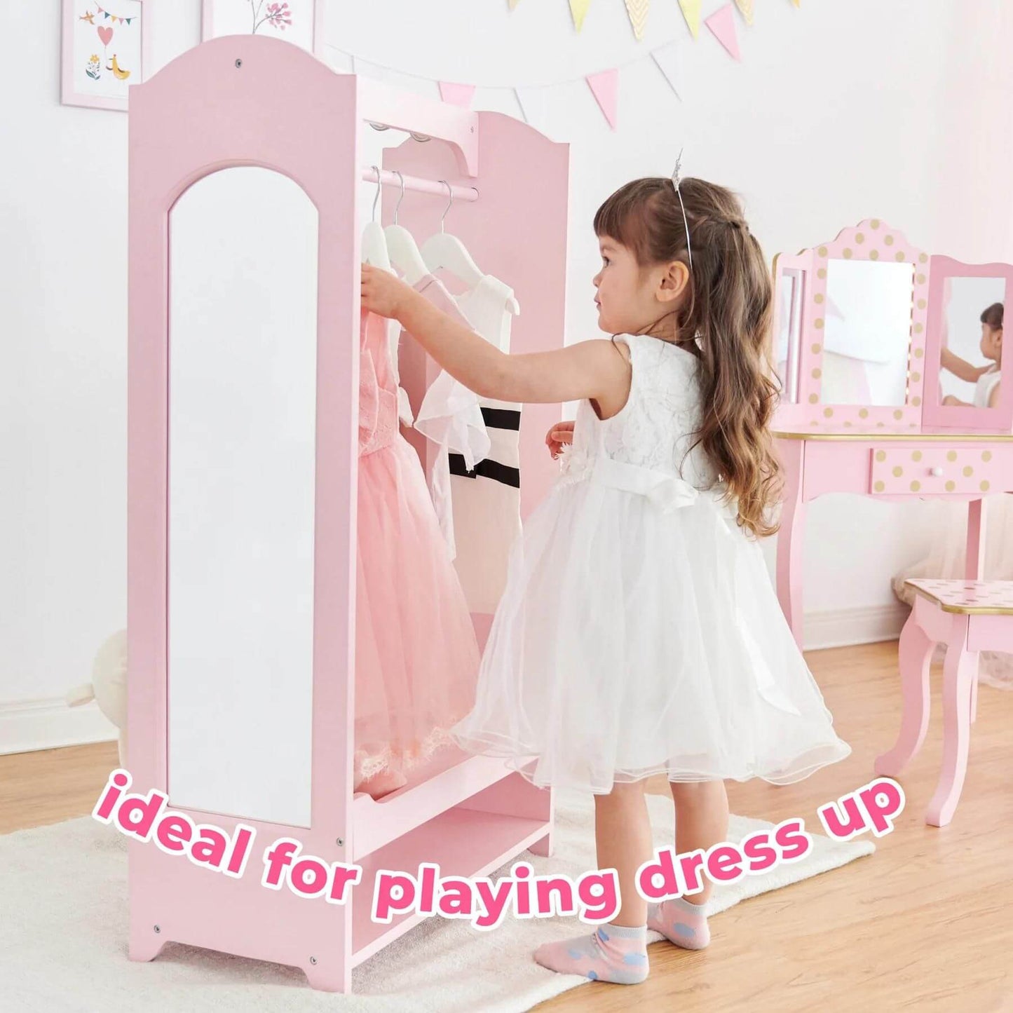 Girl Playing Dress Up at Fantasy Fields Little Princess Clothing Rack