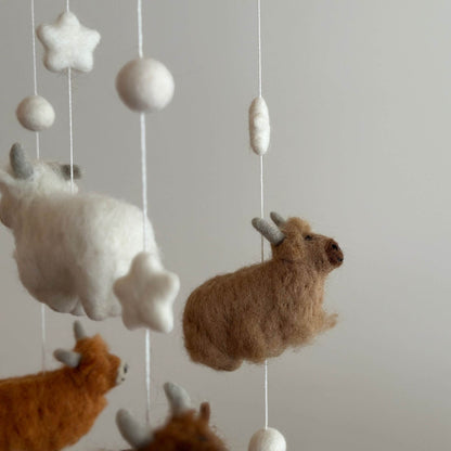Close-up of Ganapati Crafts Co. Felt Baby Mobile - Highland Cow