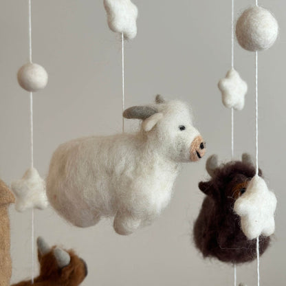 Close-up of Ganapati Crafts Co. Felt Baby Mobile - Highland Cow