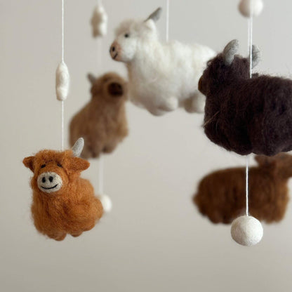 Close-up of Ganapati Crafts Co. Felt Baby Mobile - Highland Cow