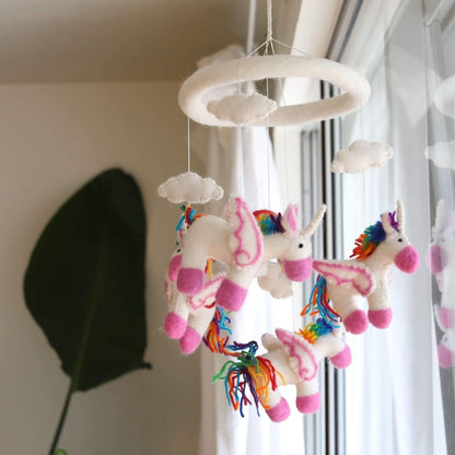 Ganapati Crafts Co. Felt Unicorn Baby Mobile hanging from a ceiling