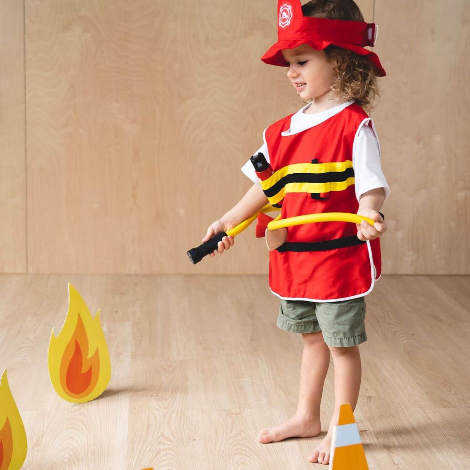 PlanToys Fire Fighter Play Set against a beige wall.