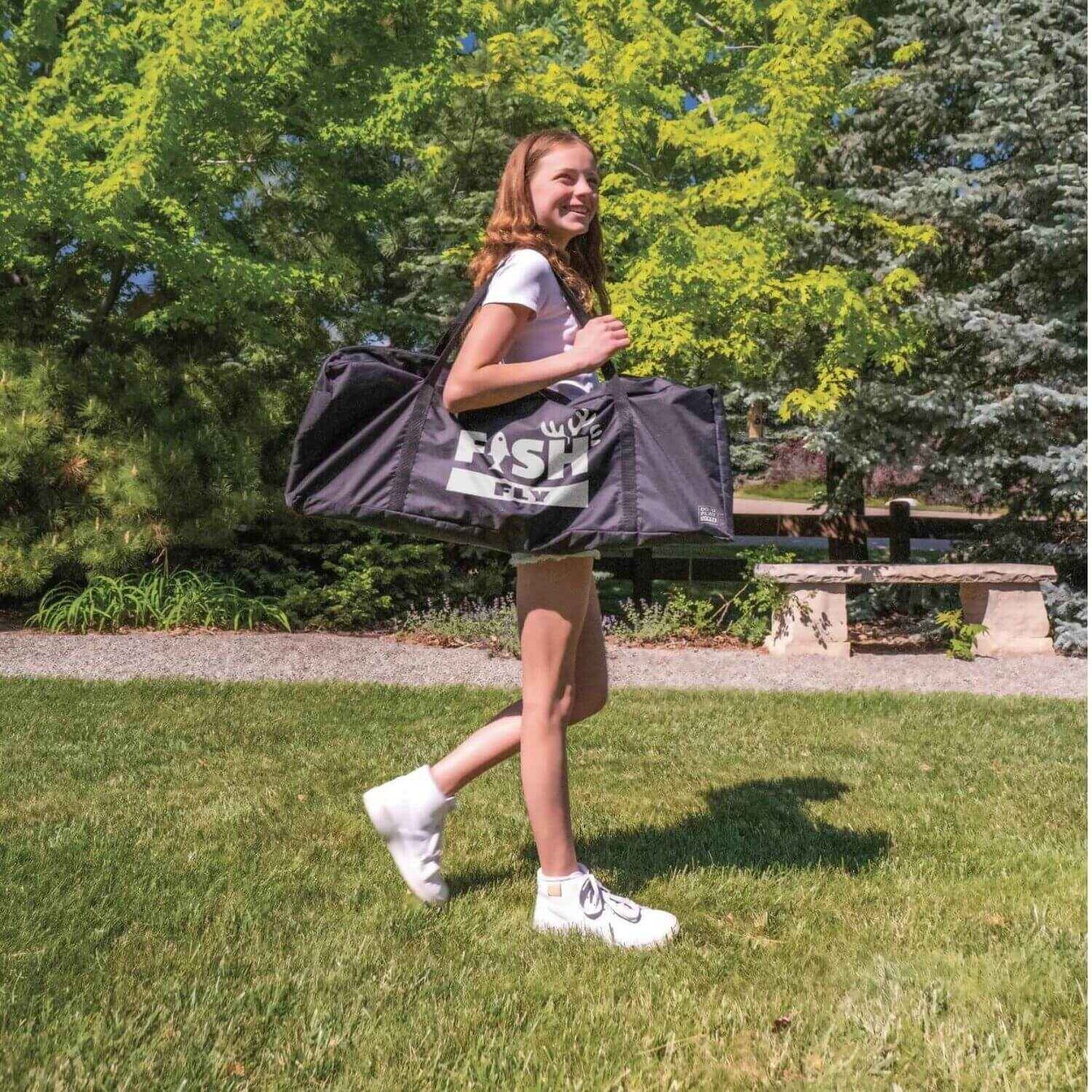 Girl Carrying DO-U-PLAY Fish Fly Yard Game