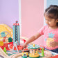 Child playing with Teamson Kids Florida Amusement Park Wooden Activity Table in a bright room.