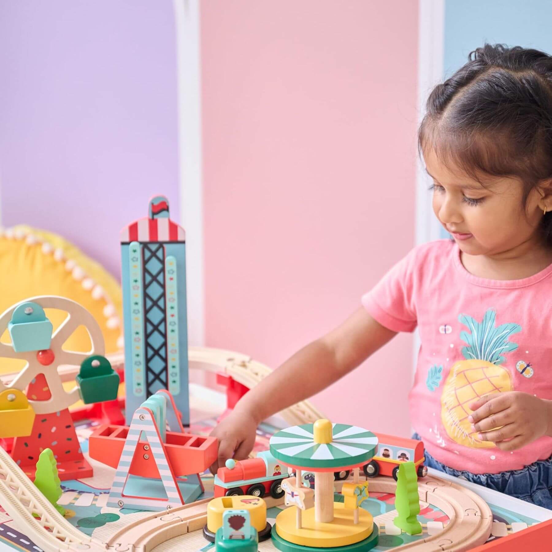Child playing with Teamson Kids Florida Amusement Park Wooden Activity Table in a bright room.