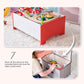 Children's toy table with Teamson Kids Florida Amusement Park Wooden Activity Table and storage bin on a carpeted floor.