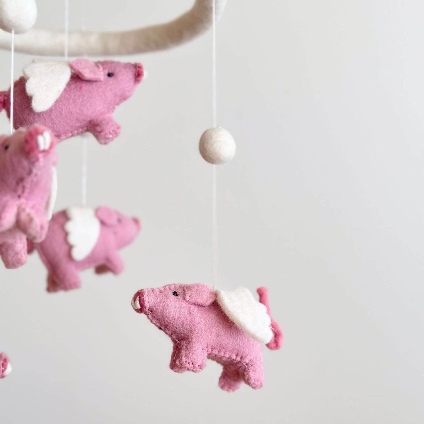 Close-up of Ganapati Crafts Co. Felt Baby Mobile - Flying Pig